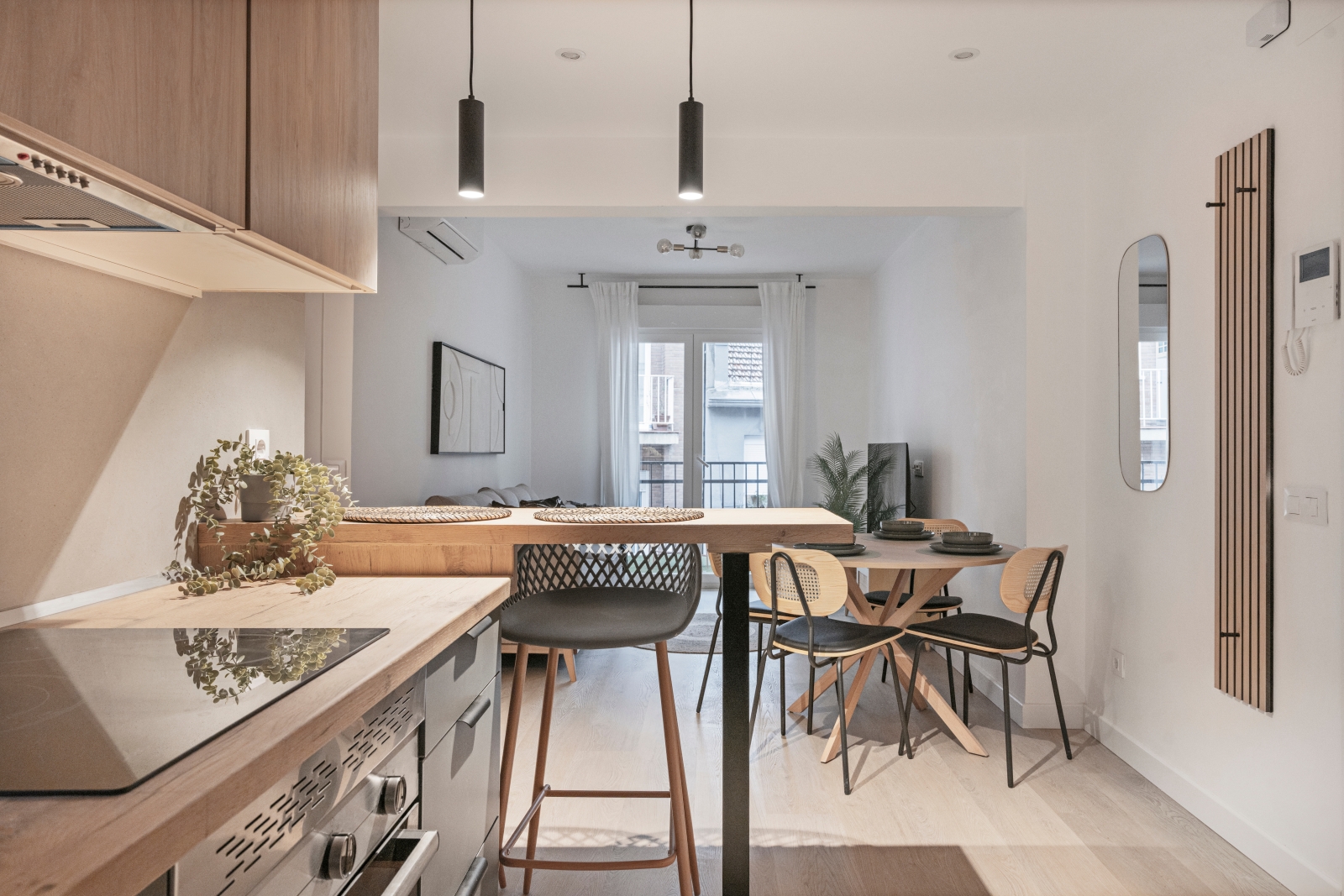 Ed Neir Construction does garage conversions/main-floor living suite/ADU: kitchen has seamless, easy-clean microcement floor.