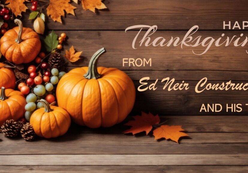 Ed Neir Construction wishes everyone a Happy Thanksgiving - planks of wood with pumpkins, fall leaves, and grapes