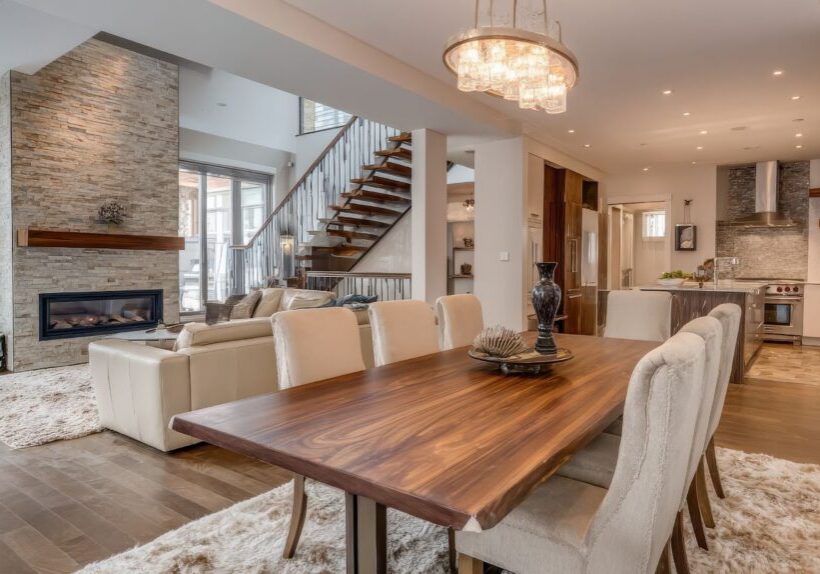 Ed Neir Construction does strategic whole house remodels. Open flow dining room, kitchen, and family room with fireplace.